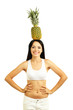 Girl with fresh pineapple isolated on white