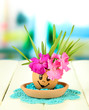 Photo: Flowers growing from egg shell, on bright background Flowers growing from egg shell, on bright background