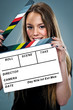 Young Beautiful Woman with a Slate in Front of Her Face