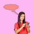 Attractive brunette girl dressed in red with a mobile thinking