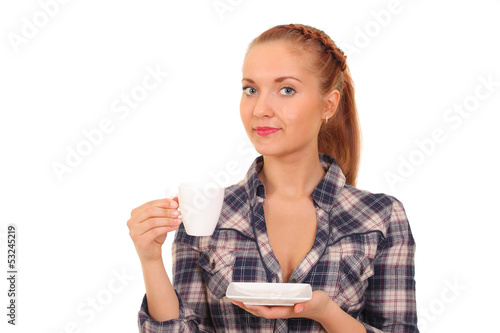 Photo: young girl holding a cup of coffee. young girl holding a cup of coffee.