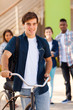 male teen high school student with a bicycle