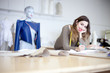 Photo: Fashion designer working on designs in the studio Fashion designer working on designs in the studio