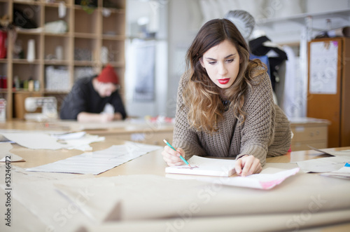Photo: Fashion designers working in the studio Fashion designers working in the studio