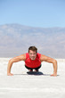 Photo: Fitness man crossfit training push-ups in desert Fitness man crossfit training push-ups in desert