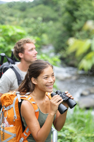 Photo: Hiking couple of hikers in outdoor activity Hiking couple of hikers in outdoor activity