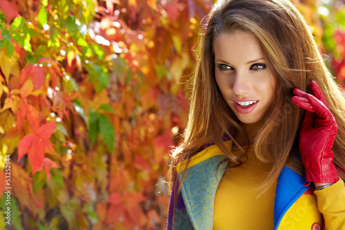 Photo: autumn woman on leafs background autumn woman on leafs background