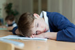Diligent student sitting at desk, classroom