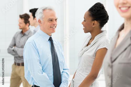 Photo: Business People Talking With Each Other Business People Talking With Each Other