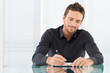 Photo: Businessman Writing Document Businessman Writing Document