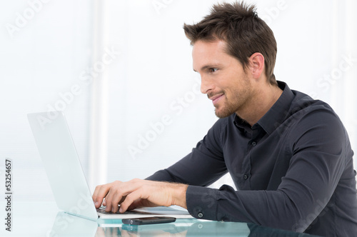 Photo: Businessman Working On Laptop Businessman Working On Laptop