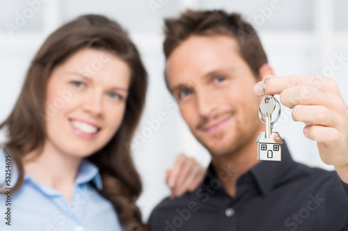 Photo: Young Couple Showing Keys Of New House Young Couple Showing Keys Of New House