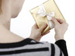 Young woman holding a present