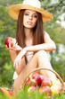 Photo: Apple woman. Very beautiful ethnic model eating red apple in the Apple woman. Very beautiful ethnic model eating red apple in the