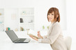 Beautiful young businesswoman working in office