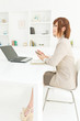 Beautiful young businesswoman working in office