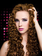 Foto: beautiful woman with long curly hairs beautiful woman with long curly hairs