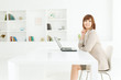 Beautiful young businesswoman working in office