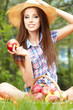 Photo: Apple woman. Very beautiful ethnic model eating red apple in the Apple woman. Very beautiful ethnic model eating red apple in the