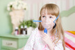 little girl makes inhalation home