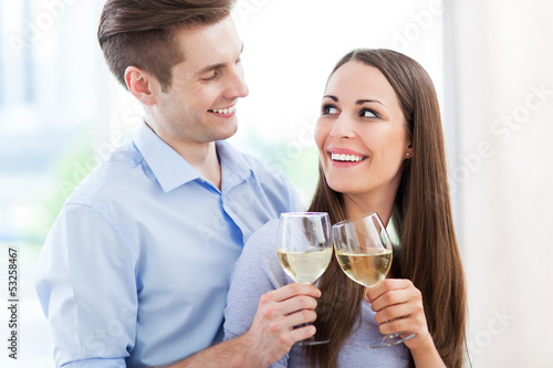 Photo: Young couple toasting Young couple toasting
