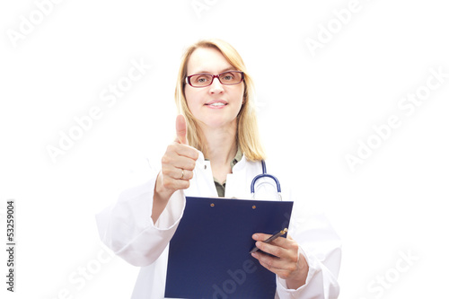 Photo: Female doctor with clipboard showing thumb up Female doctor with clipboard showing thumb up