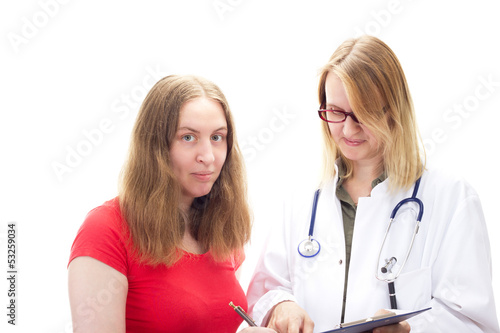 Photo: Female doctor with young female patient Female doctor with young female patient