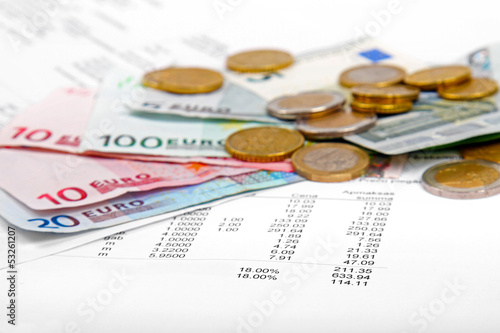 Photo: euro money coins and banknotes with payment bill euro money coins and banknotes with payment bill