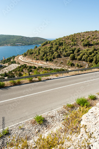 Photo: winding road in deserted landscape winding road in deserted landscape