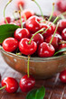Vintage copper cup with fresh cherries