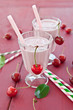 Two glasses with cherry milkshake