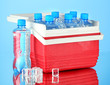 Photo: Traveling refrigerator with bottles of water and ice cubes, Traveling refrigerator with bottles of water and ice cubes,