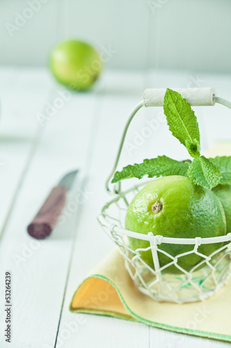 Photo: Fresh green limes in a country kitchen Fresh green limes in a country kitchen