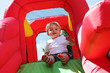Photo: Child on bouncy castle slide Child on bouncy castle slide
