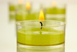 Lighted candles with beads close up