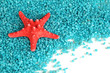 Starfish on blue crystals of sea salt background