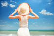 Redhead girl on the beach in spring time.