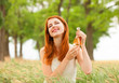 Redhead girl with perfume at outdoor