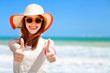 Photo: Redhead girl on the beach in spring time. Redhead girl on the beach in spring time.