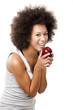 African American  young woman holding and eating an apple
