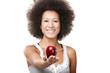 African American  young woman holding and showing a red apple