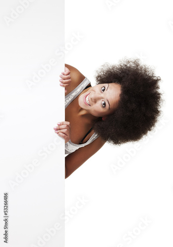Photo: Woman holding a white billboard Woman holding a white billboard