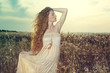 Young beautiful girl on a summer field