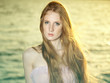 Beautiful redhead girl at pond
