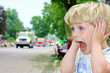 Child Covering Ears at Loud Parade
