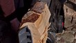 Crashing half o a log of wood in the machine .