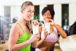 Photo: women in the gym drinking protein shake women in the gym drinking protein shake