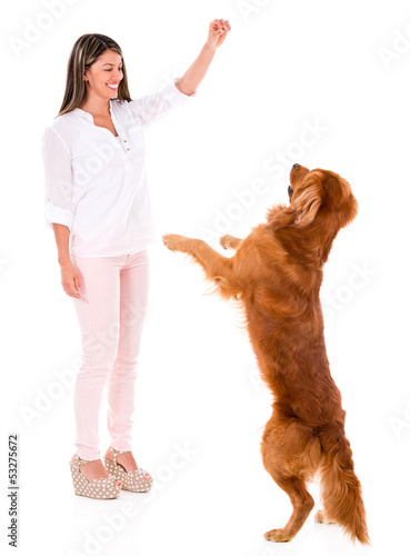 Photo: Woman playing with a dog Woman playing with a dog