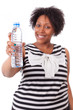 Photo: Overweight young black woman holding an water bottle - African p Overweight young black woman holding an water bottle - African p