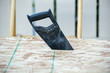 Side view of a hand saw in wood